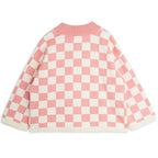 Pull tricoté en coton biologique rose vintage motif damier avec épaules tombantes et finitions côtelées pour enfant
