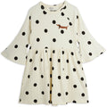 Robe enfant en coton biologique écru à pois imprimé chien avec manches trompette évasées