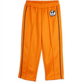 Pantalon en polyester recyclé sportif orange à imprimé patchwork, avec taille élastiquée et pli marqué sur le devant pour enfant