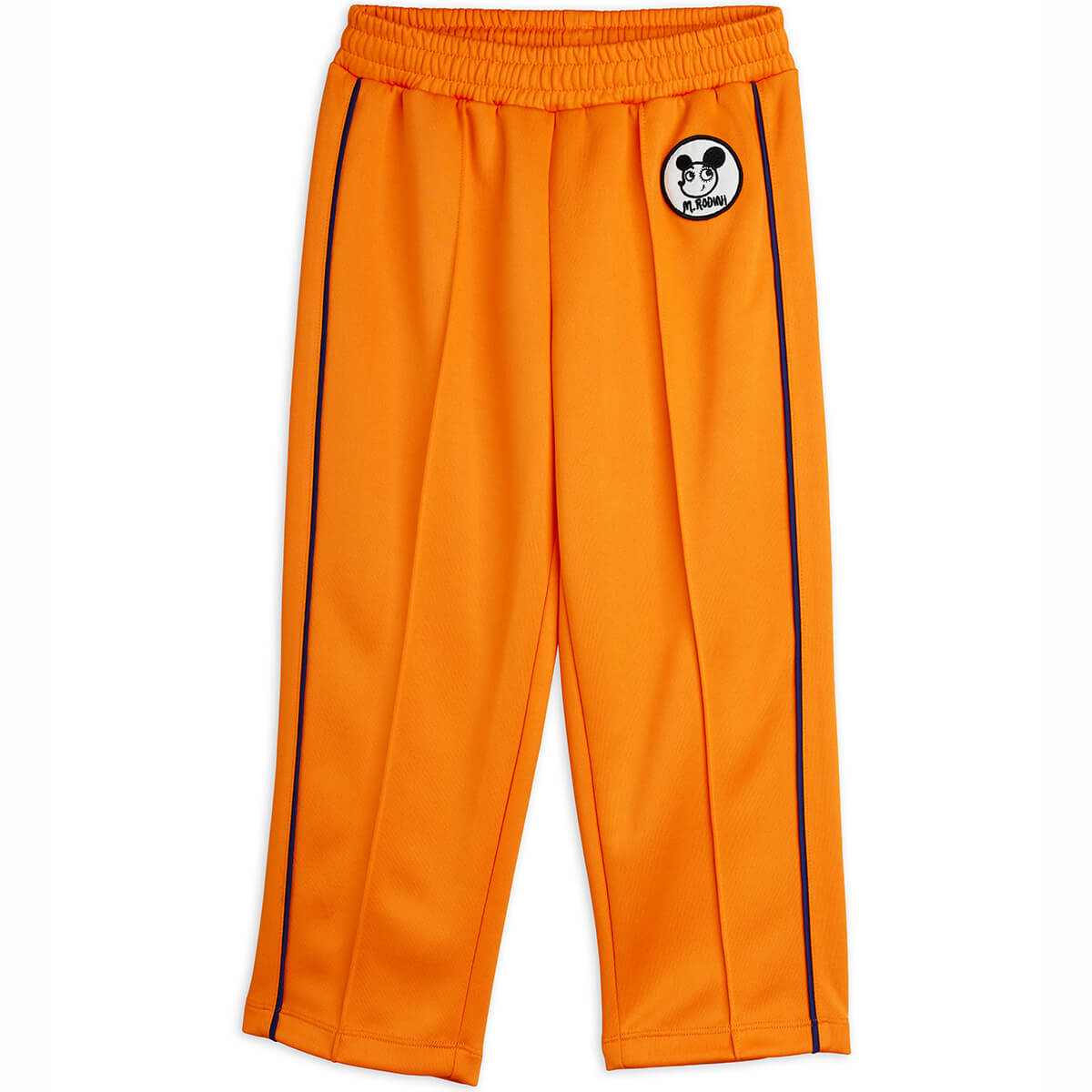 Pantalon en polyester recyclé sportif orange à imprimé patchwork, avec taille élastiquée et pli marqué sur le devant pour enfant