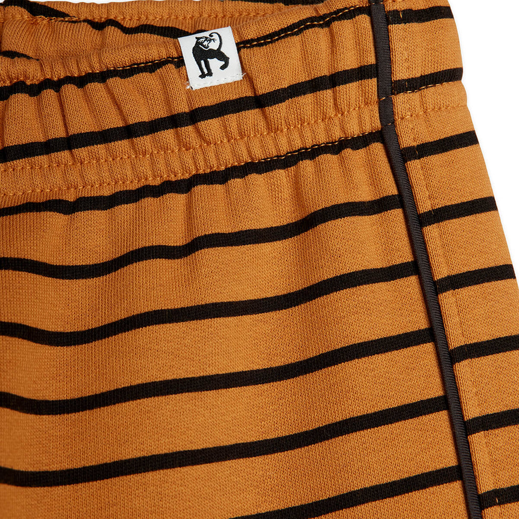 Pantalon de survêtement sport marron rayé en coton biologique avec taille et chevilles élastiquées pour enfants