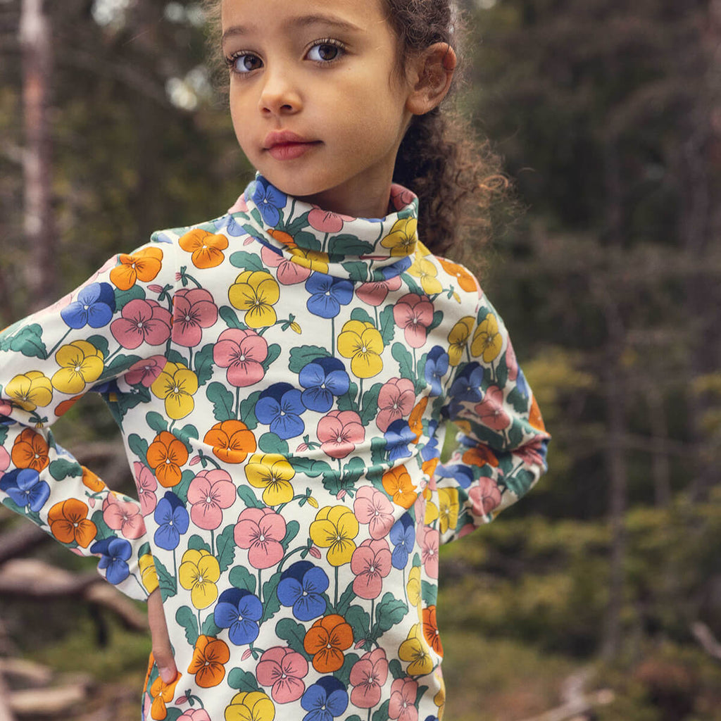 Haut à col roulé pour enfants en coton biologique extensible, motif floral multicolore fantaisie sur l'ensemble